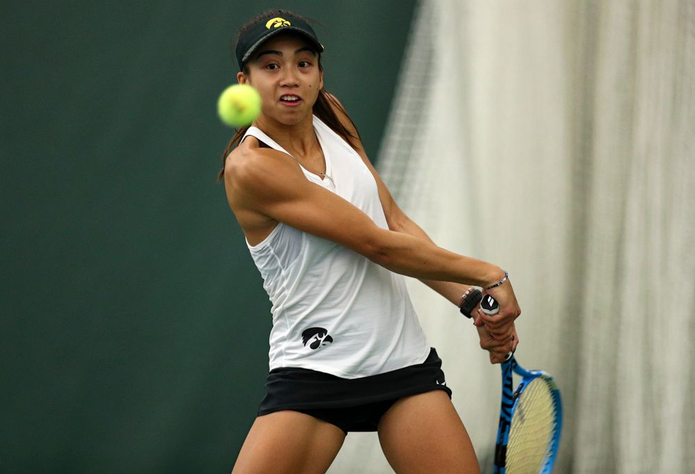 Iowa’s Michelle Bacalla returns a shot during her doubles match at the Hawkeye Tennis and Recreation Complex in Iowa City on Sunday, February 23, 2020. (Stephen Mally/hawkeyesports.com)