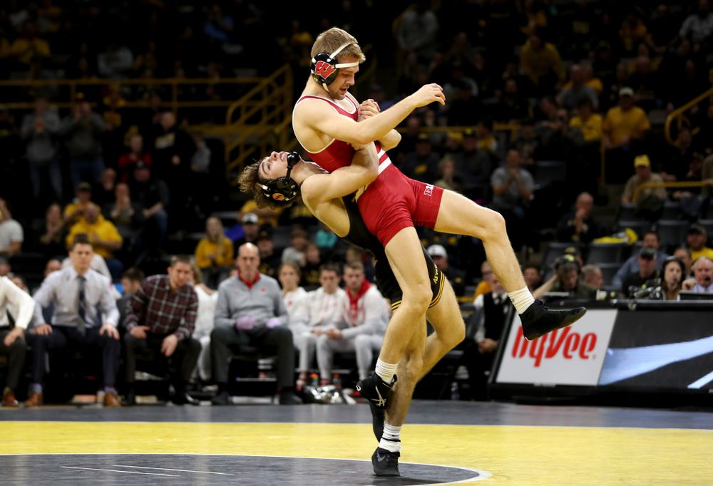 IowaÕs Austin DeSanto wrestles WisconsinÕs Seth Gross at 133 pounds Sunday, December 1, 2019 at Carver-Hawkeye Arena. DeSanto won the match 6-2. (Brian Ray/hawkeyesports.com)