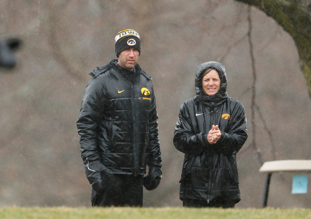 Iowa Men's Golf Head Coach Tyler Stith and Women's Golf Head Coach Megan Menzel watch the action during day two of the 2018 Hawkeye Invitational Friday, April 13, 2018 at Finkbine Golf Course. (Brian Ray/hawkeyesports.com)