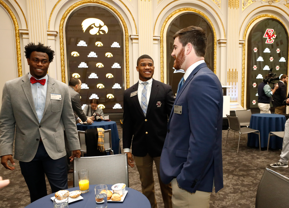 Iowa Hawkeyes linebacker Josey Jewell (43), defensive back Joshua Jackson (15), offensive lineman Sean Welsh (79) and head coach Kirk Ferentz ring the opening bell at the New York Stock Exchange Tuesday, December 26, 2017 in New York. (Brian Ray/hawkeyesports.com)