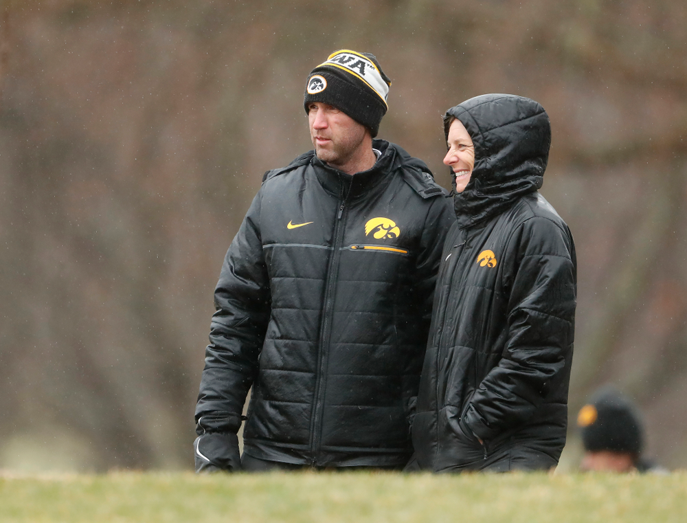 Iowa Men's Golf Head Coach Tyler Stith and Women's Golf Head Coach Megan Menzel watch the action during day two of the 2018 Hawkeye Invitational Friday, April 13, 2018 at Finkbine Golf Course. (Brian Ray/hawkeyesports.com)