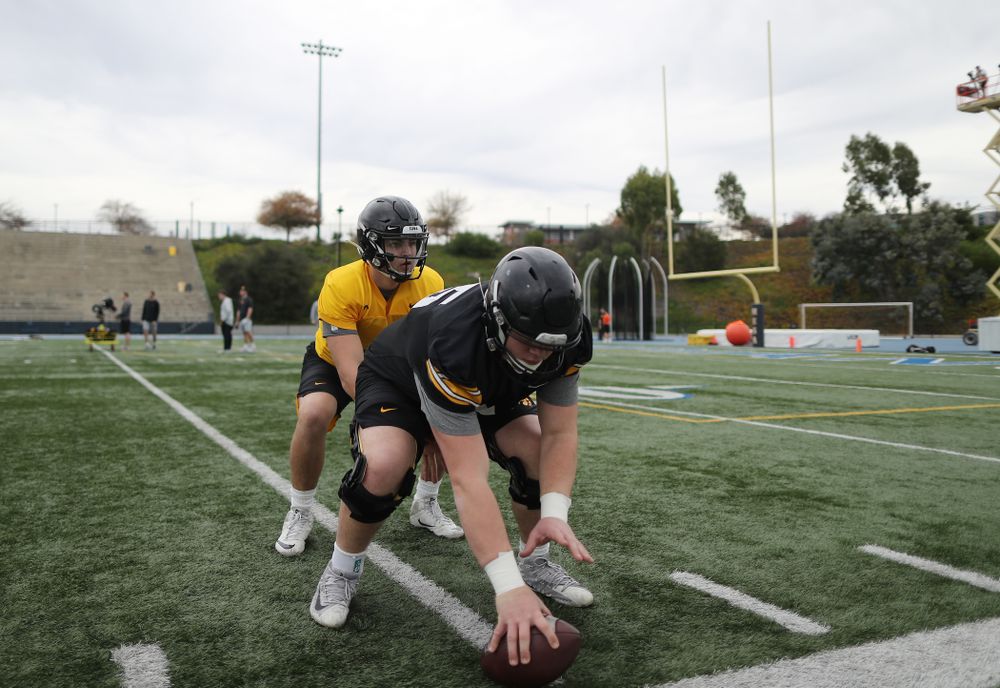 Iowa Hawkeyes offensive lineman Tyler Linderbaum (65) and quarterback Nate Stanley (4) during practice Sunday, December 22, 2019 at Mesa College in San Diego. (Brian Ray/hawkeyesports.com)