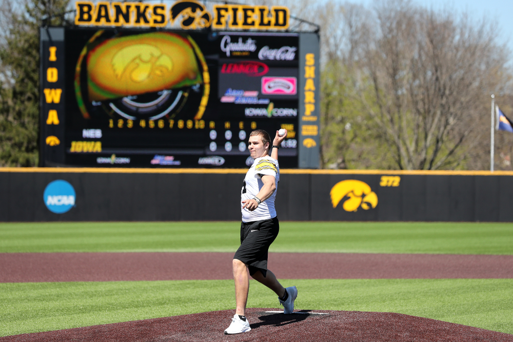 Iowa Hawkeyes quarterback Nate Stanley (4) throws out a first pitch against the Nebraska Cornhuskers Saturday, April 20, 2019 at Duane Banks Field. (Brian Ray/hawkeyesports.com)