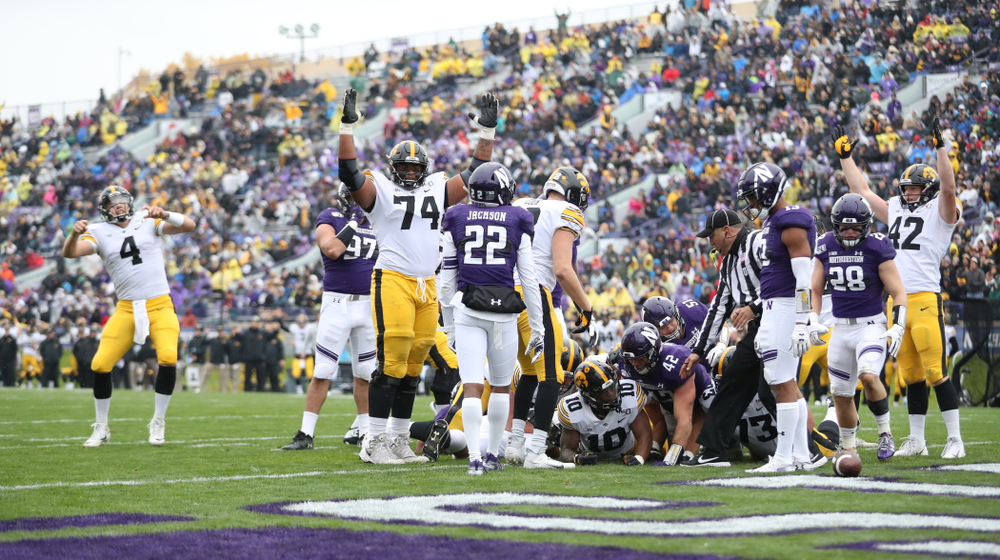Iowa Hawkeyes offensive lineman Tristan Wirfs (74) celebrates a touchdown by running back Mekhi Sargent (10) against the Northwestern Wildcats Saturday, September 28, 2019 at Kinnick Stadium. (Max Allen/hawkeyesports.com)