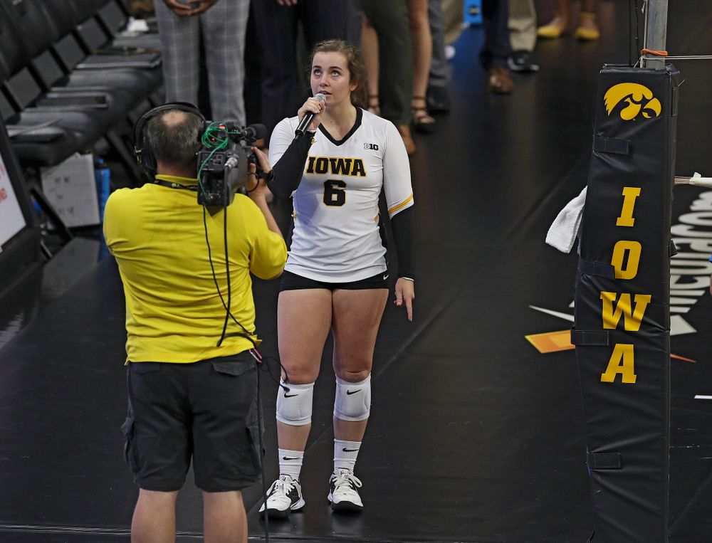 Iowa’s Emma Lowes (6) sings the National Anthem before their Big Ten/Pac-12 Challenge match against Colorado at Carver-Hawkeye Arena in Iowa City on Friday, Sep 6, 2019. (Stephen Mally/hawkeyesports.com)