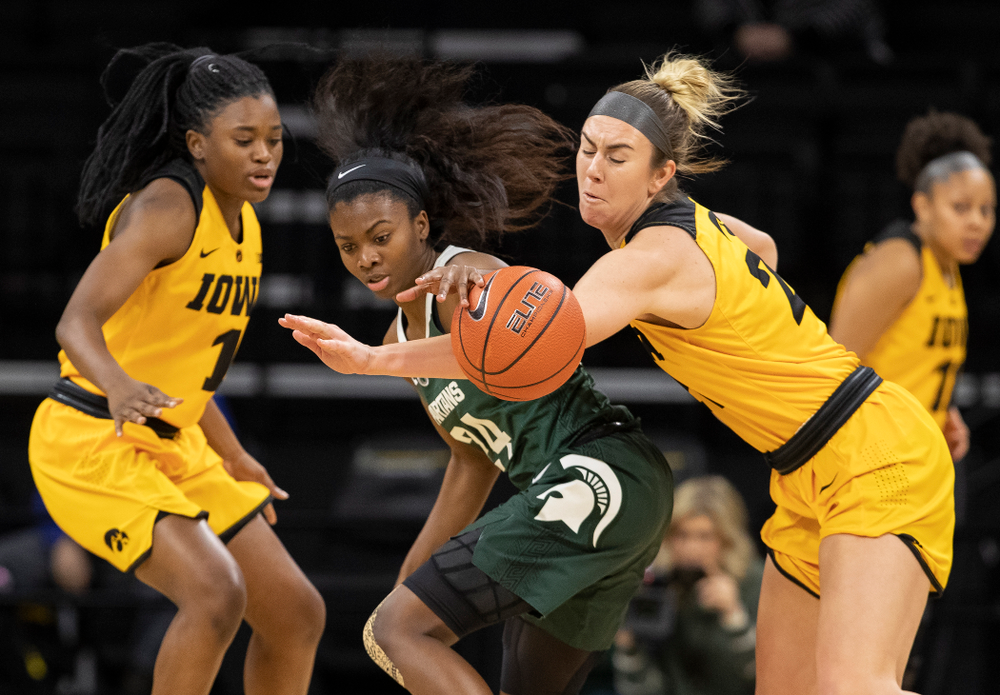 Iowa Hawkeyes forward Hannah Stewart (21) steals the ball against the Michigan State Spartans Thursday, February 7, 2019 at Carver-Hawkeye Arena. (Brian Ray/hawkeyesports.com)
