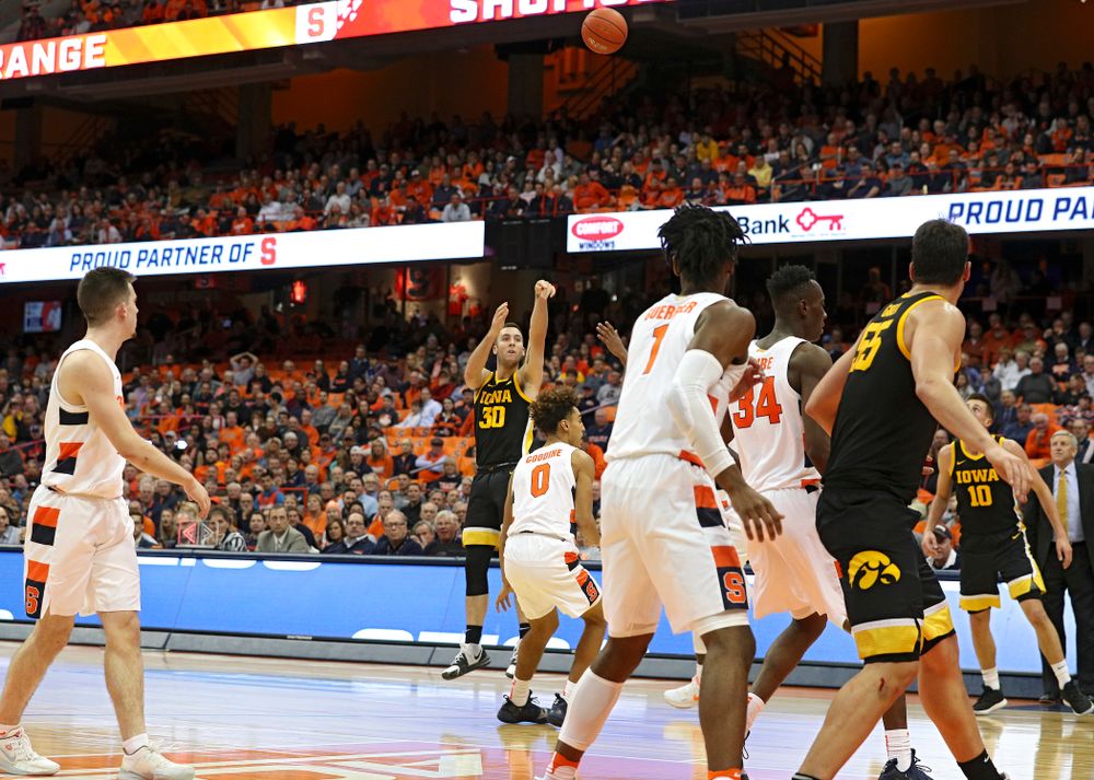 Iowa Hawkeyes guard Connor McCaffery (30) makes a 3-pointer during the second half of their ACC/Big Ten Challenge game at the Carrier Dome in Syracuse, N.Y. on Tuesday, Dec 3, 2019. (Stephen Mally/hawkeyesports.com)