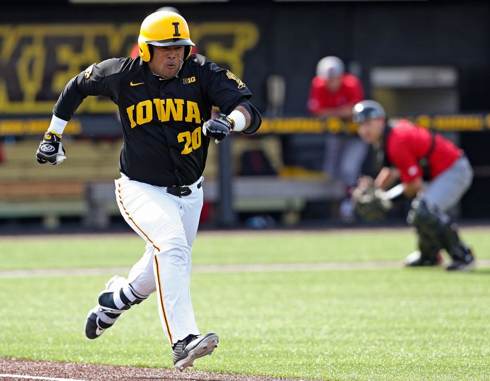 Iowa Hawkeyes designated hitter Izaya Fullard (20) gets a bunt single during the sixth inning of their game against Rutgers at Duane Banks Field in Iowa City on Saturday, Apr. 6, 2019. (Stephen Mally/hawkeyesports.com)
