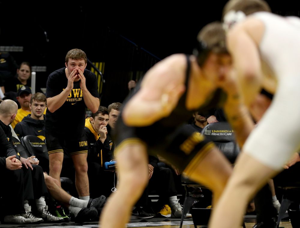 Jacob Warner cheers on Iowa’s Cash Wilcke as he wrestles Ohio State’s Kollin Moore at 197 pounds Friday, January 24, 2020 at Carver-Hawkeye Arena. Moore won the match 8-3. (Brian Ray/hawkeyesports.com)