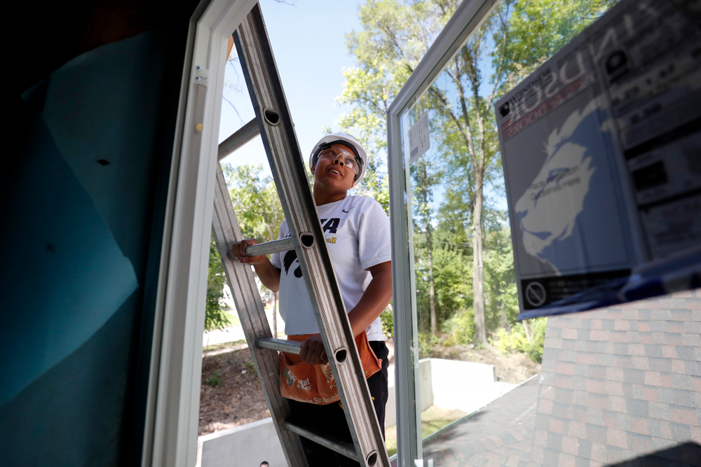Iowa Hawkeyes guard Tania Davis (11) works on the Habitat for Humanity Women's Build Wednesday, September 26, 2018 in Iowa City. (Brian Ray/hawkeyesports.com)