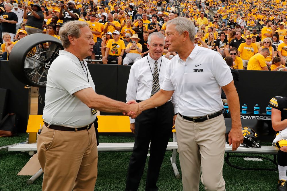Iowa Hawkeyes head coach Kirk Ferentz talks with University of Iowa President Bruce Harreld and athletics director Gary Barta before their game against the Northern Illinois Huskies Saturday, September 1, 2018 at Kinnick Stadium. (Brian Ray/hawkeyesports.com)