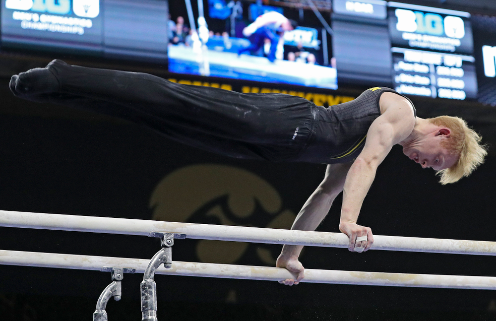Iowa's Nick Merryman competes in the parallel bars during the first day of the Big Ten Men's Gymnastics Championships at Carver-Hawkeye Arena in Iowa City on Friday, Apr. 5, 2019. (Stephen Mally/hawkeyesports.com)