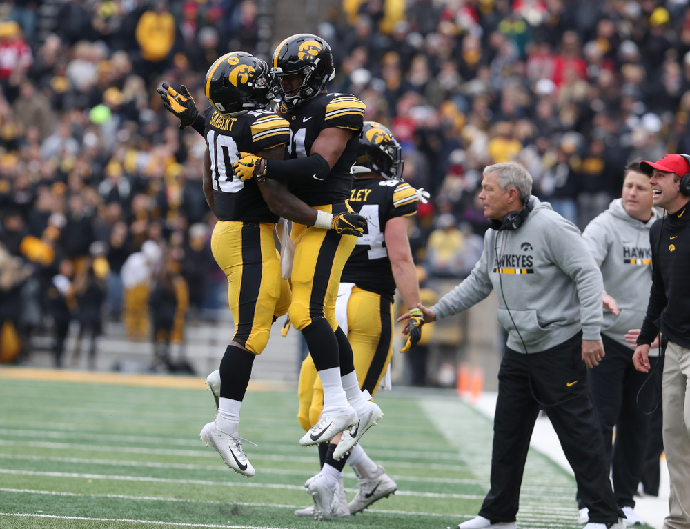 Iowa Hawkeyes running back Mekhi Sargent (10) celebrates with running back Ivory Kelly-Martin (21) after scoring against the Nebraska Cornhuskers Friday, November 23, 2018 at Kinnick Stadium. (Brian Ray/hawkeyesports.com)