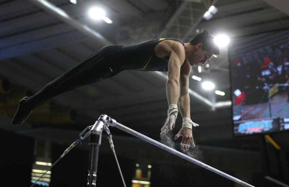 Iowa's Andrew Herrador competes on the high bar against the Ohio State Buckeyes Saturday, March 16, 2019 at Carver-Hawkeye Arena. (Brian Ray/hawkeyesports.com)