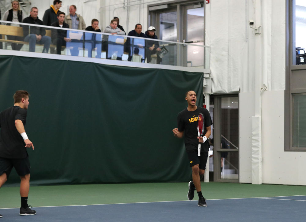 Will Davies and Oliver Okonkwo plays a doubles match against the Miami Hurricanes Friday, February 8, 2019 at the Hawkeye Tennis and Recreation Complex. (Brian Ray/hawkeyesports.com)