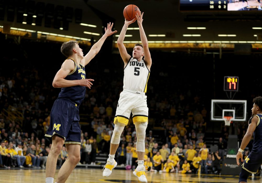 Iowa Hawkeyes guard CJ Fredrick (5) pulls up for a shot against the Michigan Wolverines Friday, January 17, 2020 at Carver-Hawkeye Arena. (Brian Ray/hawkeyesports.com)