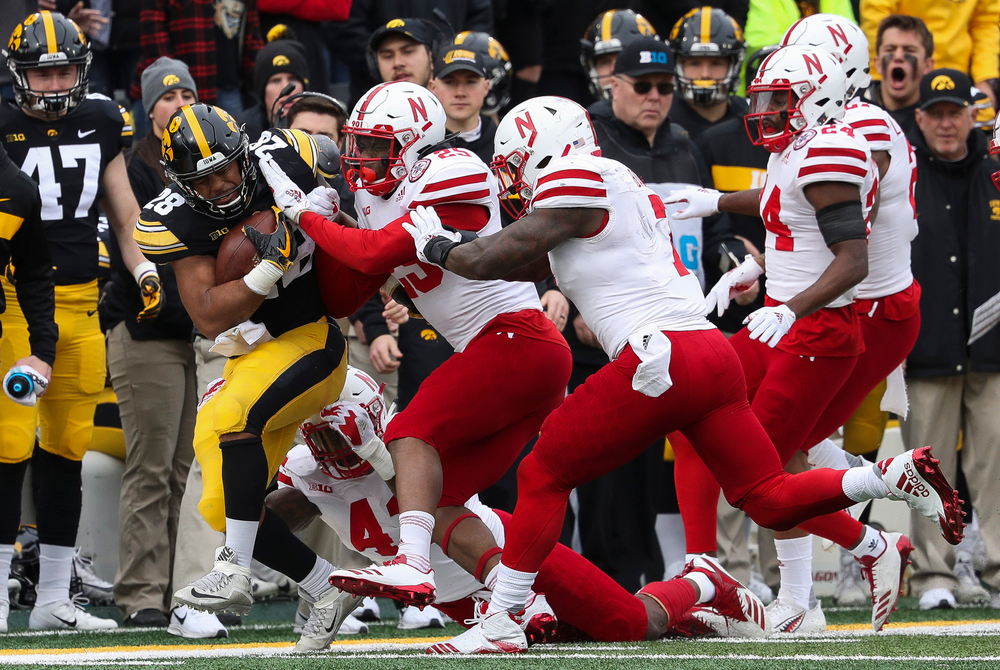 Iowa Hawkeyes running back Toren Young (28) runs the ball during a game against Nebraska at Kinnick Stadium on November 23, 2018. (Tork Mason/hawkeyesports.com)