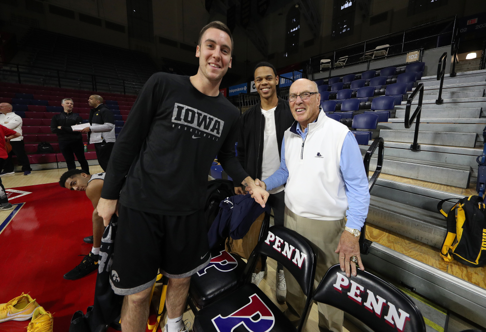 Iowa Hawkeyes guard Connor McCaffery (30) takes a photo with Bob Weinhauer, Fran McCafferyÕs head coach at Penn, before practice at the Palestra Friday, January 3, 2020 in Philadelphia. (Brian Ray/hawkeyesports.com)