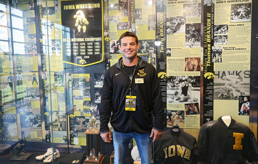 2019 University of Iowa Athletics Hall of Fame inductee Eric Juergens by the wrestling display at the University of Iowa Athletics Hall of Fame in Iowa City on Friday, Aug 30, 2019. (Stephen Mally/hawkeyesports.com)