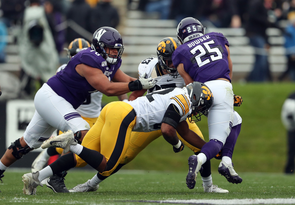 Iowa Hawkeyes linebacker Amani Jones (52) and linebacker Dillon Doyle (43) against the Northwestern Wildcats Saturday, October 26, 2019 at Ryan Field in Evanston, Ill. (Brian Ray/hawkeyesports.com)