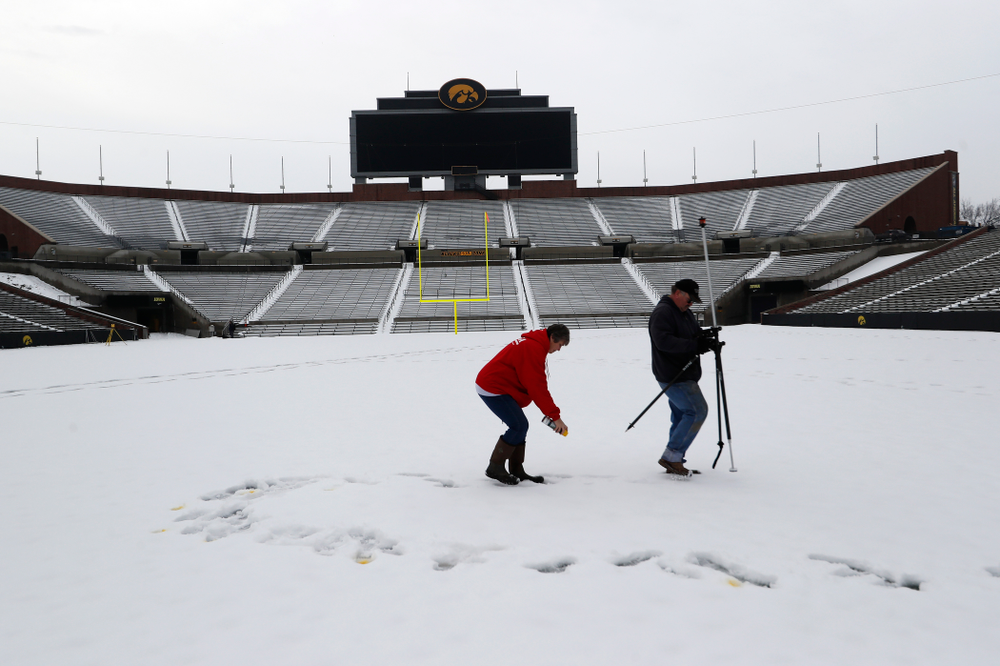 Members of the Iowa Athletics Turf Management staff create the #SnowWave for kids in the Stead Family Children's Hospital Thursday, February
