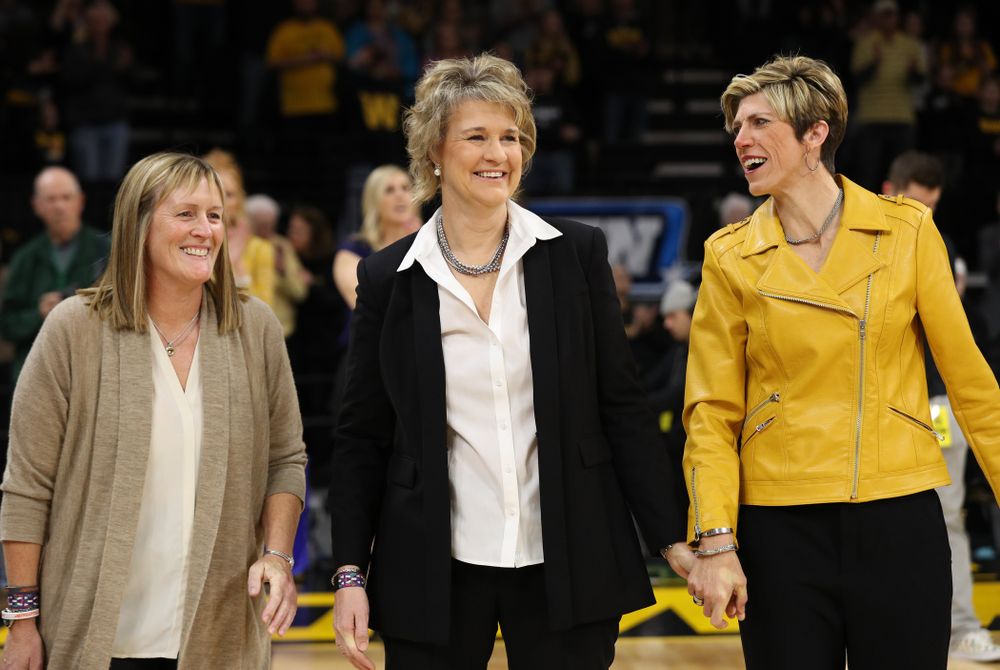 Iowa Hawkeyes head coach Lisa Bluder watches as her daughter Emma sings the National Anthem before the Iowa Hawkeyes game against the Northwestern Wildcats Sunday, March 3, 2019 at Carver-Hawkeye Arena. (Brian Ray/hawkeyesports.com)