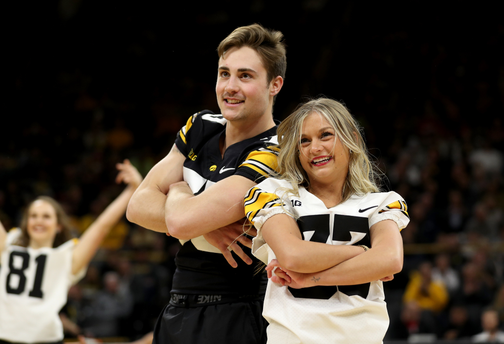 Members of the Hawkeye Football team performs with the Iowa Dance Team at halftime of the Iowa Hawkeyes game against the Ohio State Buckeyes Thursday, February 20, 2020 at Carver-Hawkeye Arena. (Brian Ray/hawkeyesports.com)