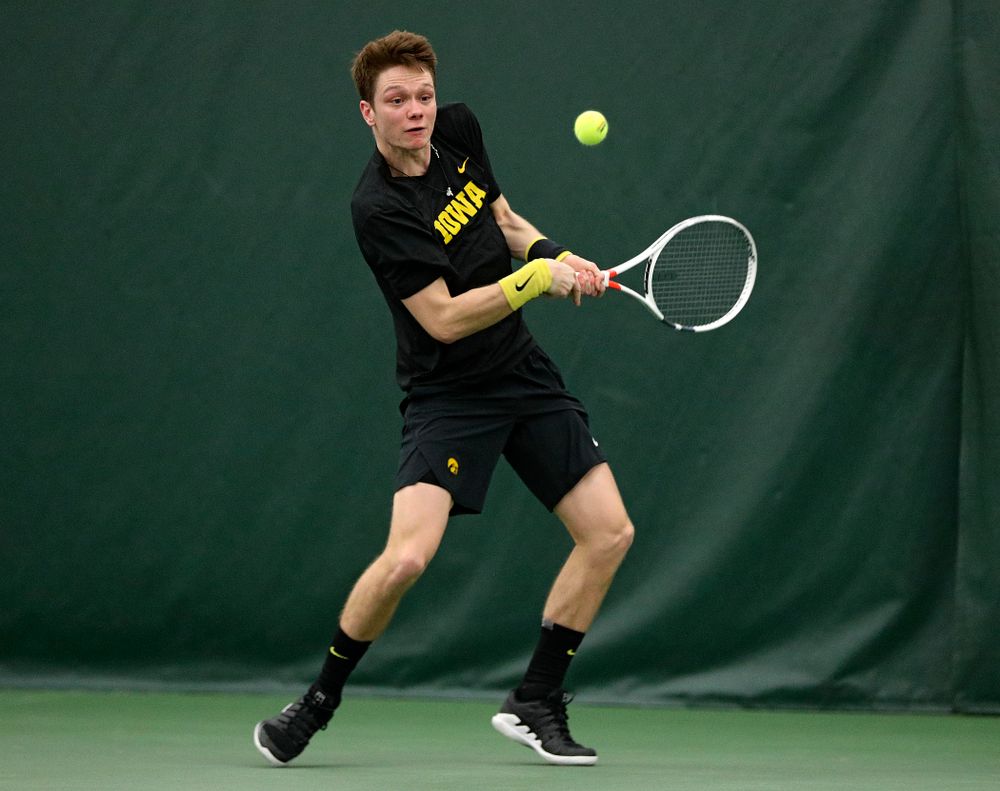 Iowa’s Jason Kerst returns a shot during his singles match at the Hawkeye Tennis and Recreation Complex in Iowa City on Friday, March 6, 2020. (Stephen Mally/hawkeyesports.com)