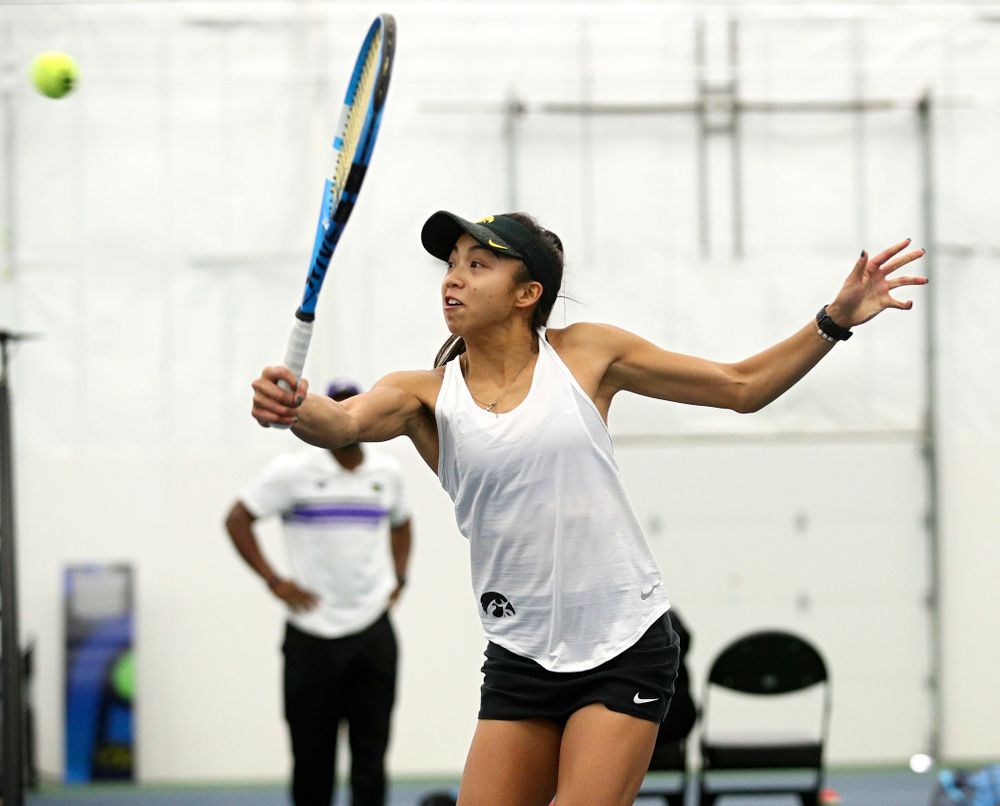 Iowa’s Michelle Bacalla returns a shot during her doubles match at the Hawkeye Tennis and Recreation Complex in Iowa City on Sunday, February 23, 2020. (Stephen Mally/hawkeyesports.com)