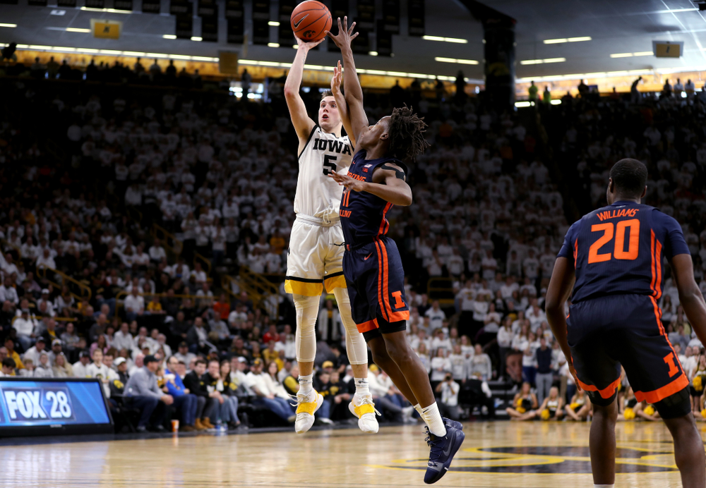 Iowa Hawkeyes guard CJ Fredrick (5) pulls up for a three point basket against the Illinois Fighting Illini Sunday, February 2, 2020 at Carver-Hawkeye Arena. (Brian Ray/hawkeyesports.com)