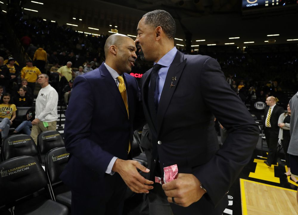 Iowa Hawkeyes assistant coach Billy Taylor and Michigan Wolverines head coach Juwan Howard Friday, January 17, 2020 at Carver-Hawkeye Arena. (Brian Ray/hawkeyesports.com)