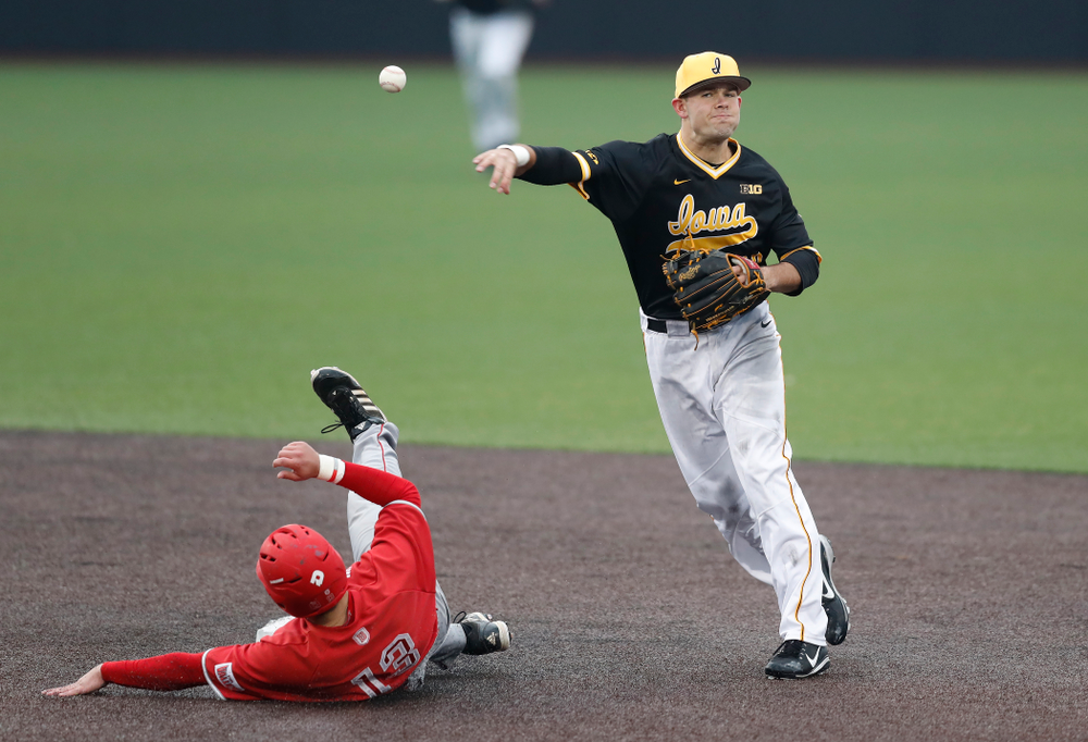 Iowa Hawkeyes infielder Kyle Crowl (23) turns a double play against the Bradley Braves Wednesday, March 28, 2018 at Duane Banks Field. (Brian Ray/hawkeyesports.com)