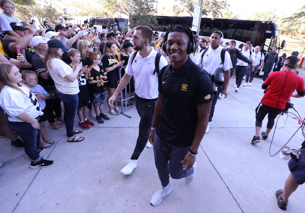 Iowa Hawkeyes wide receiver Brandon Smith (12) smiles as he arrives for the Outback Bowl Tuesday, January 1, 2019 at Raymond James Stadium in Tampa, FL. (Brian Ray/hawkeyesports.com)