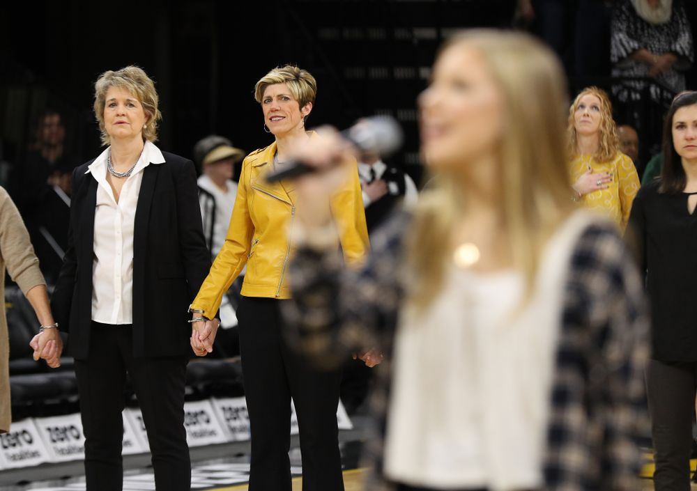 Iowa Hawkeyes head coach Lisa Bluder watches as her daughter Emma sings the National Anthem before the Iowa Hawkeyes game against the Northwestern Wildcats Sunday, March 3, 2019 at Carver-Hawkeye Arena. (Brian Ray/hawkeyesports.com)