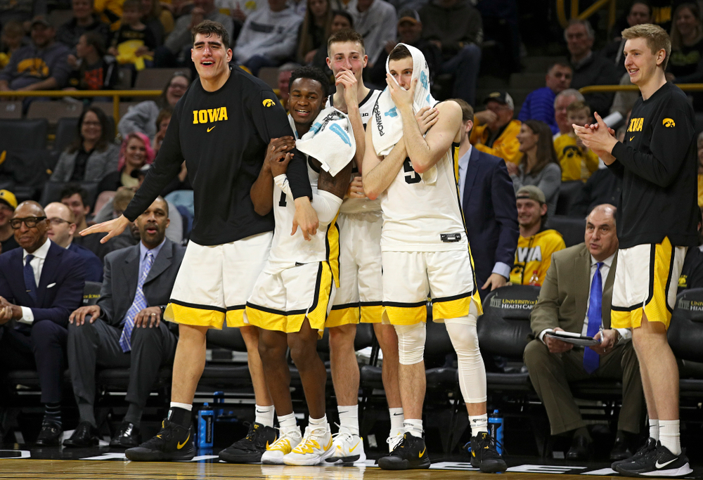 Iowa Hawkeyes center Luka Garza (55), guard Joe Toussaint (1), guard Joe Wieskamp (10), and guard CJ Fredrick (5) react after forward Riley Till (not pictured) was fouled as he tried to dunk over Kennesaw State Owls forward Bryson Lockley (not pictured) during the second half of their their game at Carver-Hawkeye Arena in Iowa City on Sunday, December 29, 2019. (Stephen Mally/hawkeyesports.com)