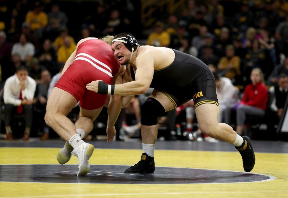 IowaÕs Tony Cassioppi wrestles WisconsinÕs Trent Hillger at heavyweight Sunday, December 1, 2019 at Carver-Hawkeye Arena. Cassioppi won the match 3-2. (Brian Ray/hawkeyesports.com)