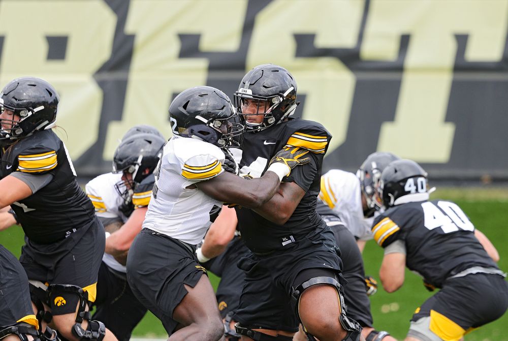 Iowa Hawkeyes offensive lineman Tristan Wirfs (74) blocks Iowa Hawkeyes linebacker Amani Jones (52)
during Fall Camp Practice No. 15 at the Hansen Football Performance Center in Iowa City on Monday, Aug 19, 2019. (Stephen Mally/hawkeyesports.com)