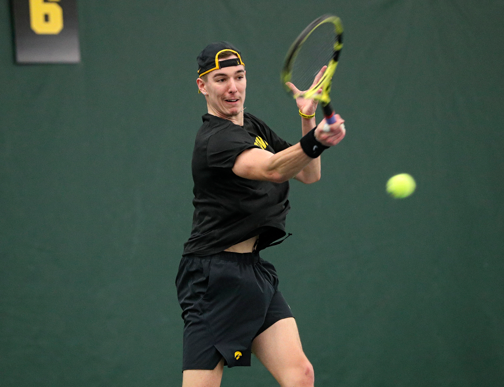 Iowa’s Nikita Snezhko returns a shot during his singles match at the Hawkeye Tennis and Recreation Complex in Iowa City on Friday, February 14, 2020. (Stephen Mally/hawkeyesports.com)