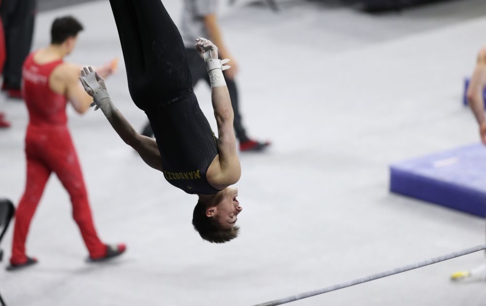 Iowa's Mitch Mandozzi competes on the high bar against Oklahoma Saturday, February 9, 2019 at Carver-Hawkeye Arena. (Brian Ray/hawkeyesports.com)