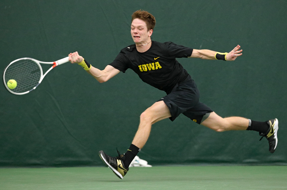 Iowa’s Jason Kerst hits a shot during his match against Marquette at the Hawkeye Tennis and Recreation Complex in Iowa City on Saturday, January 25, 2020. (Stephen Mally/hawkeyesports.com)