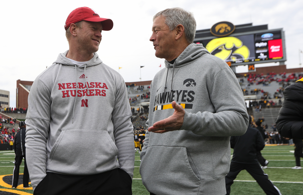 Iowa Hawkeyes head coach Kirk Ferentz talks with Nebraska Cornhuskers head coach Scott Frost before a game against Nebraska at Kinnick Stadium on November 23, 2018. (Tork Mason/hawkeyesports.com)