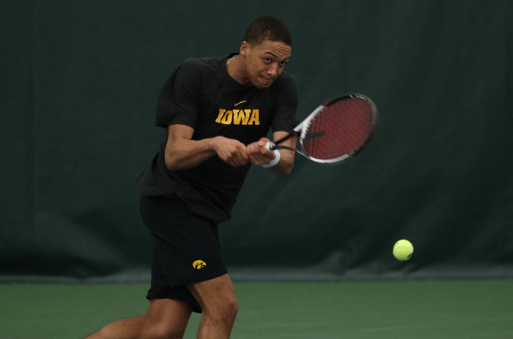 Iowa's Oliver Okonkwo against UMKC Friday, February 15, 2019 at the Hawkeye Tennis and Recreation Complex. (Brian Ray/hawkeyesports.com)