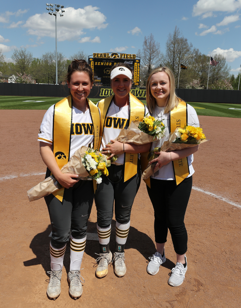 Iowa Hawkeyes seniors Mallory Kilian (11), Erin Riding (6) and Brooke Rozier pose for a photo during senior day festivities following their game against the Ohio State Buckeyes on senior day Sunday, May 5, 2019 at Pearl Field. (Brian Ray/hawkeyesports.com)