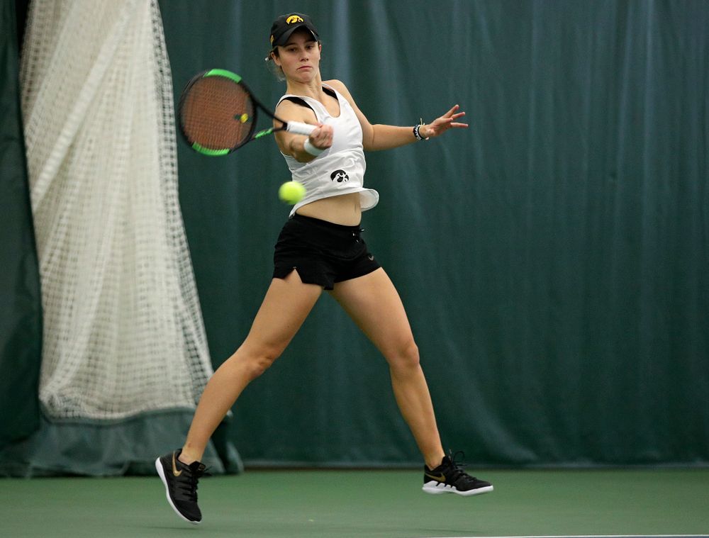 Iowa’s Elise Van Heuvelen returns a shot during her singles match at the Hawkeye Tennis and Recreation Complex in Iowa City on Sunday, February 23, 2020. (Stephen Mally/hawkeyesports.com)