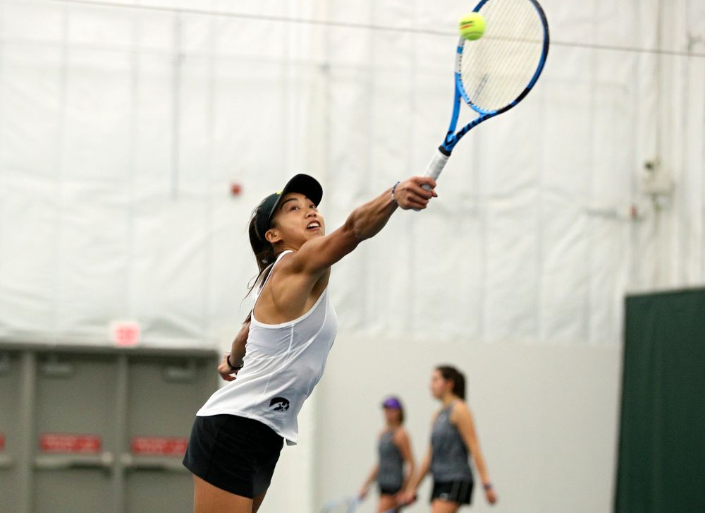 Iowa’s Michelle Bacalla returns a shot during her doubles match at the Hawkeye Tennis and Recreation Complex in Iowa City on Sunday, February 23, 2020. (Stephen Mally/hawkeyesports.com)