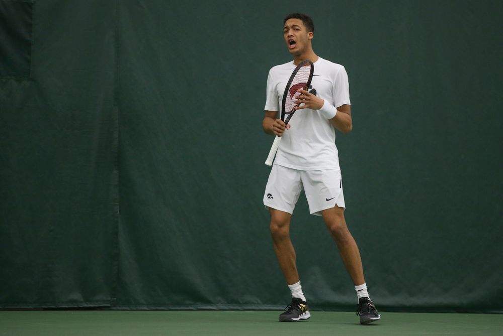 Iowa’s Oliver Okonkwo celebrates a point during the Iowa men’s tennis meet vs Nebraska on Sunday, March 1, 2020 at the Hawkeye Tennis and Recreation Complex. (Lily Smith/hawkeyesports.com)