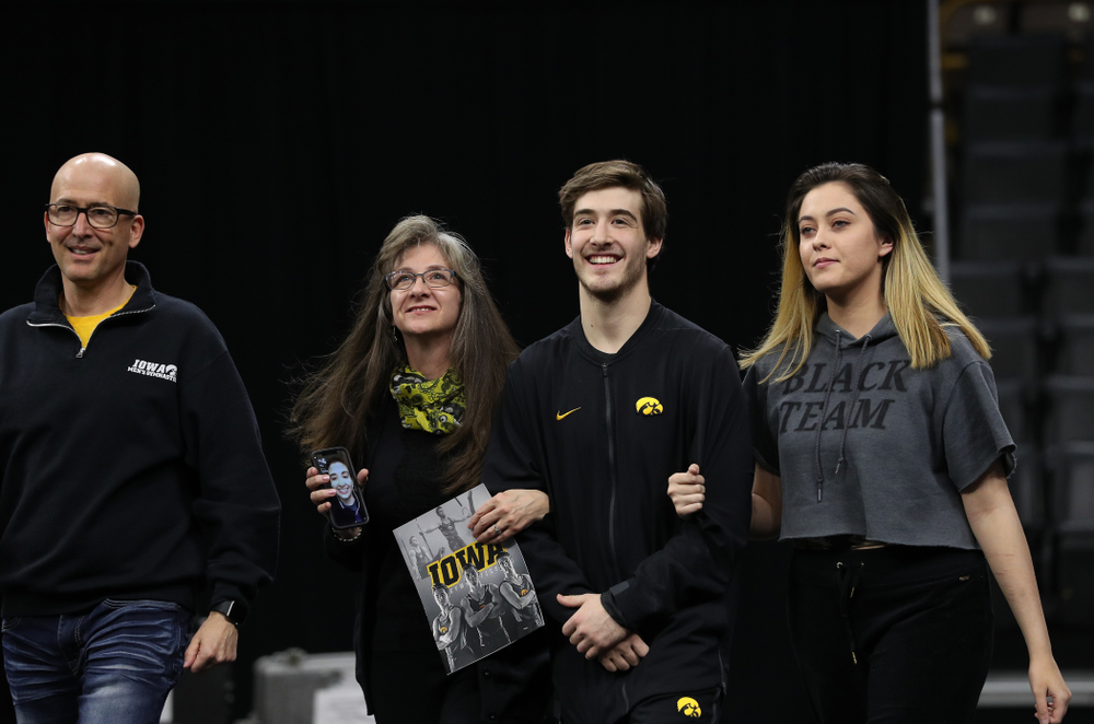 Iowa Men's Gymnast Kevin Johnson and his family during senior day ceremonies following their meet against the Ohio State Buckeyes Saturday, March 16, 2019 at Carver-Hawkeye Arena. (Brian Ray/hawkeyesports.com)