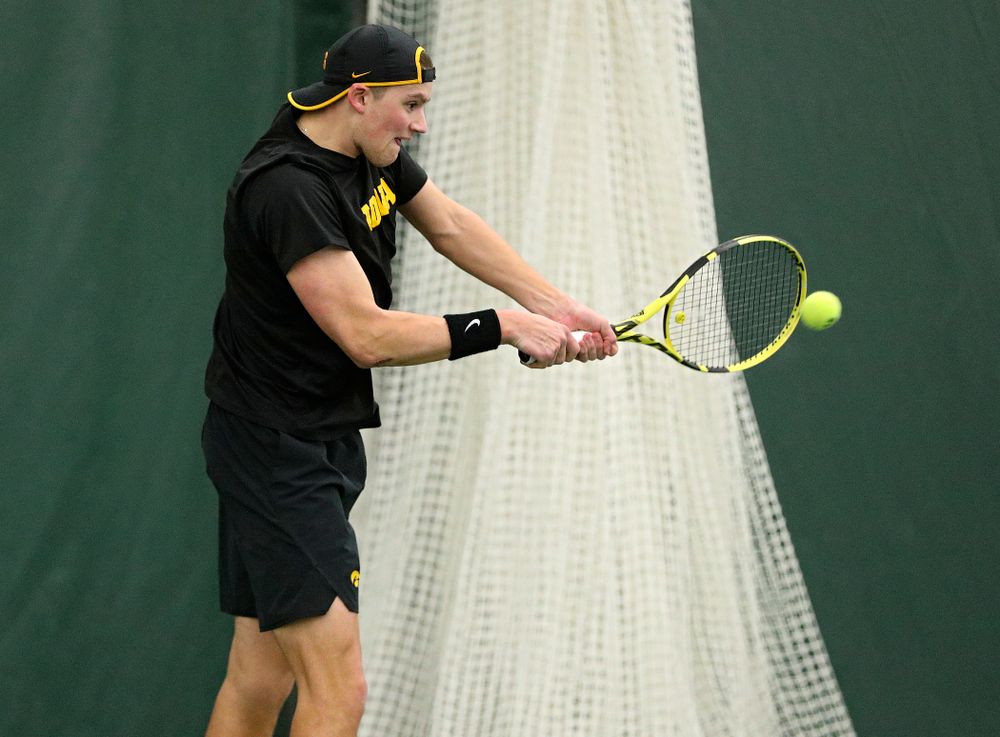 Iowa’s Joe Tyler returns a shot during his singles match at the Hawkeye Tennis and Recreation Complex in Iowa City on Friday, February 14, 2020. (Stephen Mally/hawkeyesports.com)