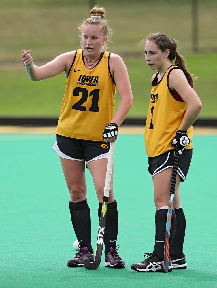 Iowa’s Makenna Maguire (21) talks with Amy Gaiero (1) as they work on a drill during practice at Grant Field in Iowa City on Thursday, Aug 15, 2019. (Stephen Mally/hawkeyesports.com)