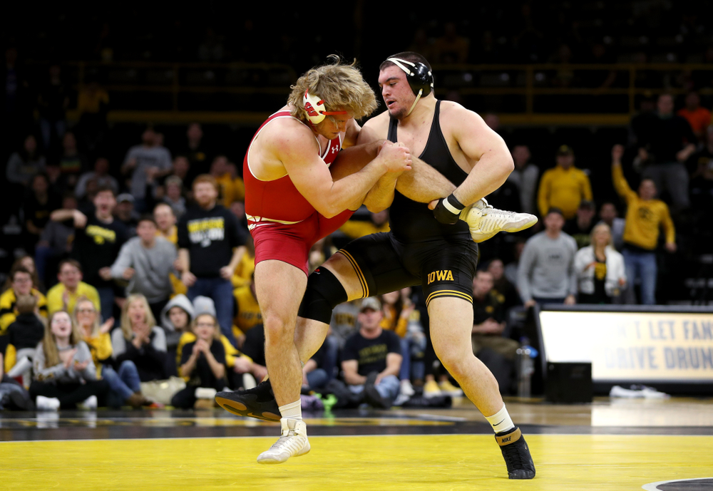 IowaÕs Tony Cassioppi wrestles WisconsinÕs Trent Hillger at heavyweight Sunday, December 1, 2019 at Carver-Hawkeye Arena. Cassioppi won the match 3-2. (Brian Ray/hawkeyesports.com)